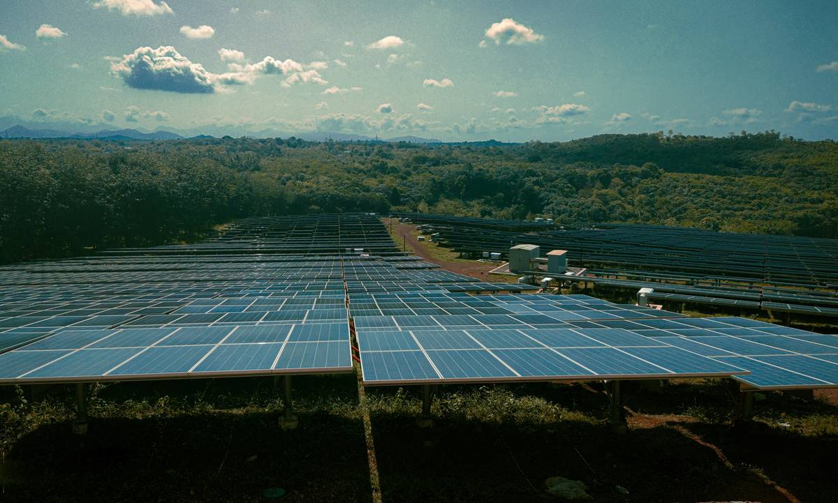 Commercial property solar panels integrated with smart monitoring dashboard showing real-time energy savings