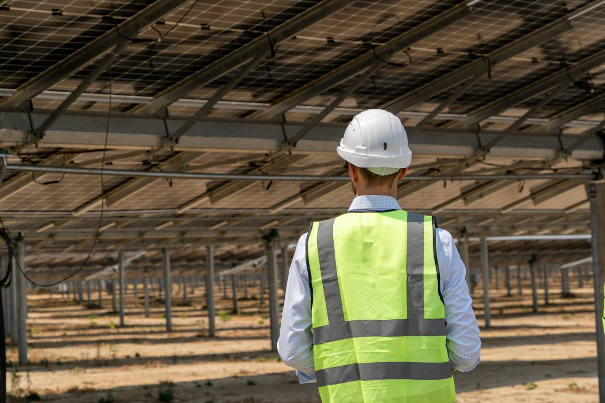Hands-on training to install solar panels on a commercial rooftop with mentor supervision