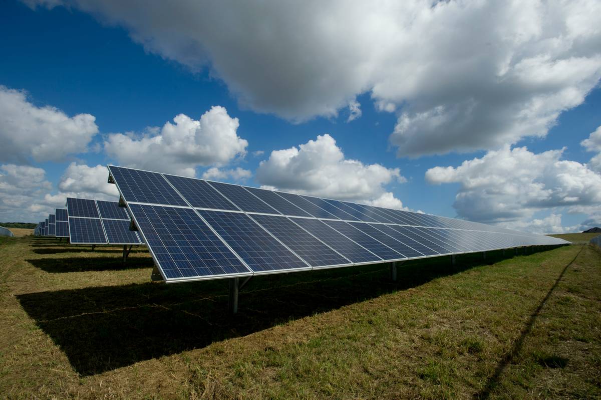 Commercial rooftop installation of solar panels for commercial use on a warehouse