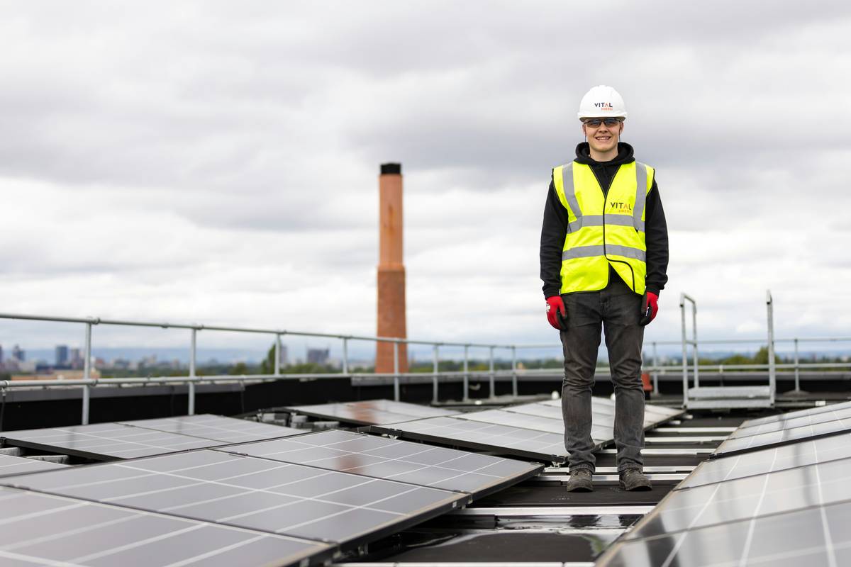 octopus energy business solar panels installed on a commercial rooftop with clear sky and minimal shading