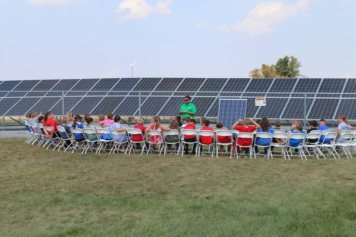 Apprentice practicing conduit runs during training to install solar panels on commercial buildings