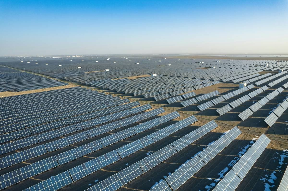 Aerial view of commercial rooftop with solar energy panel design showing optimal tilt and spacing